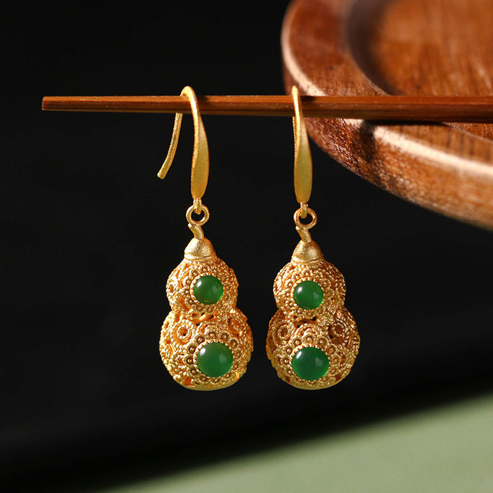 dangling gold earrings
